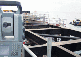 CADS Survey used two total stations facing each other to ensure that both ends of the 1.3-mile-long jetty met in the middle; this total station provided 1-cm accuracy when measuring from caisson to caisson.