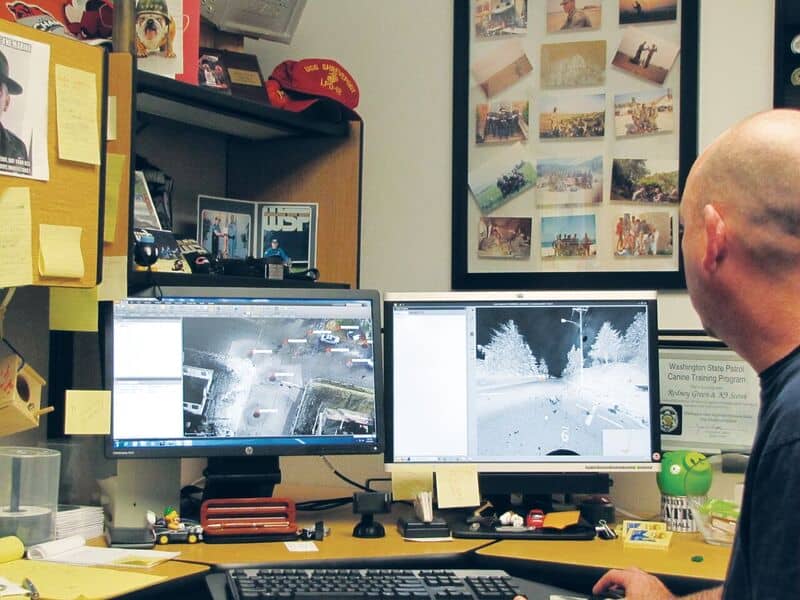 WSP trooper Rod Green inspects multiple views of a point cloud captured at a collision scene. The point cloud can be used for analysis, modeling, and animation to recreate the collision.