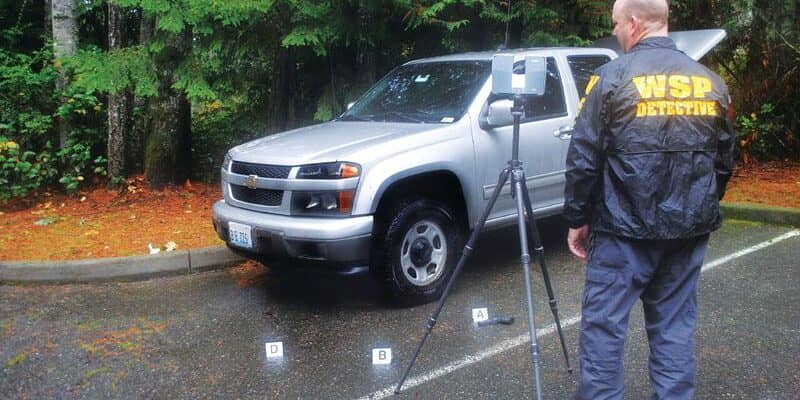 Rod Green uses a TX5 scanner to capture data; because the system can be operated by one person, it frees personnel for other tasks.