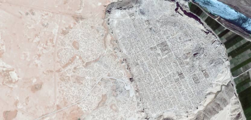 Satellite imagery of Dura Europos, Syria, an important archaeological site, shows the scale and extent of ISIS-led looting. The image (dark blue river) from April 2009 shows little impact compared to the image (light blue river) from April 2015 that shows pockmarked evidence of digging throughout the site.