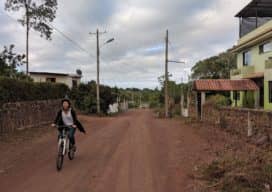 Biking to capture street imagery in the Galapagos. © Chris Beddow