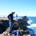 Herman Strydom and associate Guillaume van der Walt take a break and look out over the southern Atlantic Ocean with the RIEGL VZ-2000i on the remote Namibia coast. The remains are a part of Pomona, once a thriving diamond mining town in the African Sperrgebiet.