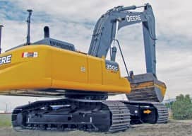 This heavy excavator (left) resolves orientation via GNSS antennas on the counterweight, and a series of tilt sensors calibrated to the moving sections of the boom provide highly accurate feedback to the operator (inset) as to progress of the bucket towards design grades per the 3D model uploaded into the controller. Another level of productivity gains comes from the telemetry fed into the site-management software and its virtual-reality viewing tools that provide real-time visual status of all equipment on the site.