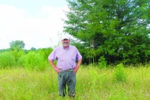 Dave McMillen analyzes the soil for wetland indicators to help determine program eligibility. 