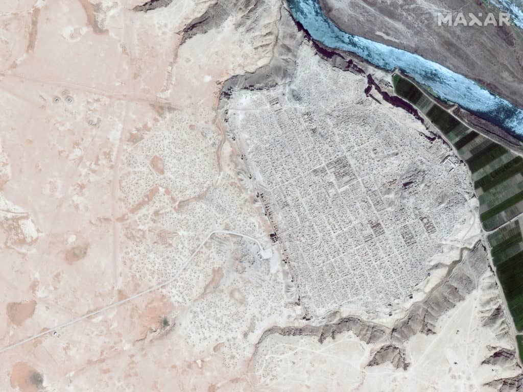 Satellite imagery of Dura Europos, Syria, an important archaeological site, shows the scale and extent of ISIS-led looting. The image (dark blue river) from April 2009 shows little impact compared to the image (light blue river) from April 2015 that shows pockmarked evidence of digging throughout the site.