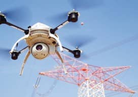 Utility corridor mapping and monitoring is a prime example of an application that is constrained by the current FAA Section 333 VLOS rule. (Here a hydroelectric power transmission tower being inspected by an Aeryon Scout. Courtesy of SkyDroid.)