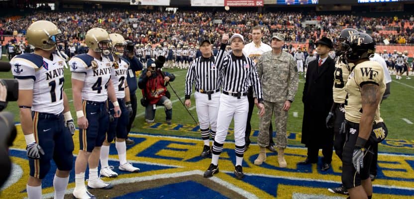 081220-N-7090S-110 Washington D.C. (Dec. 20, 2008) The referee conducts the ceremonial coin toss before the inaugural Eagle Bank Bowl between the Navy Midshipmen and the Wake Forest Demon Deacons. (U.S. Navy photo by Mass Communication Specialist 2nd Class Jhi L. Scott/Released)