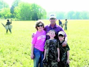 ohn Taylor  (with his wife and  grandchildren) is a dairy producer and row crop farmer; he strives to be both a good steward and a good manager.