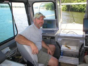 John Gustin, IV, president of SEAS, on his survey vessel.