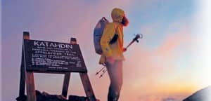 Left: A hiker stands above the clouds at the Appalachian Trail’s northern terminus: the summit of Katahdin in Baxter State Park, Maine. Courtesy of Jeffrey Stylos.