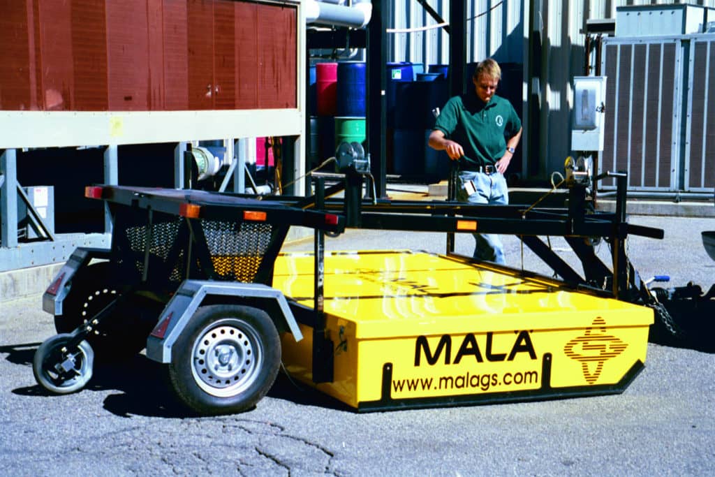 The author and the CART system in 2002, the first commercially available 3D GPR array system in the world.