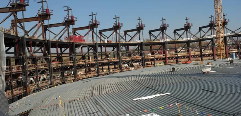 Forty-five feet below its final resting place, the top of the steel roof of Deep Space will be covered by layers of concrete and earth.