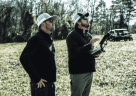 Jeff Davis (left) and Nick Tucker (right) monitor the mdLiDAR1000 as it collects data during the Big Creek surveying mission.