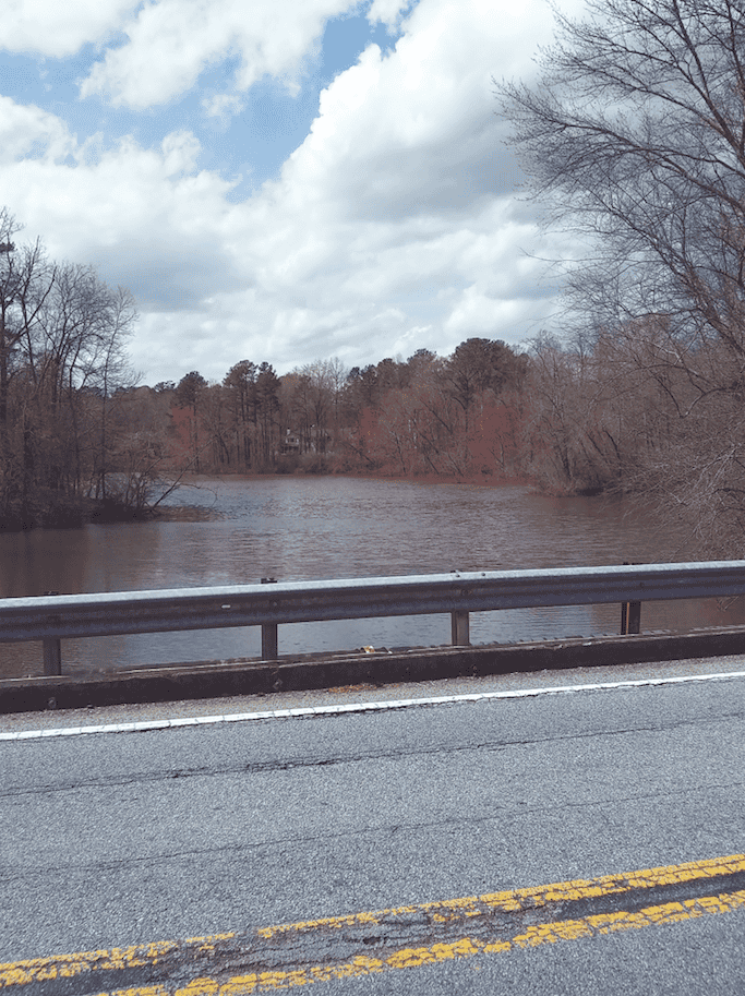 The bridge that carries Willeo Road across Willeo Creek from Fulton County to Cobb County in Georgia is being replaced, but it took some expert surveying to determine the exact county line, which was somewhere in the middle of Willeo Creek. Photo by William Helbig